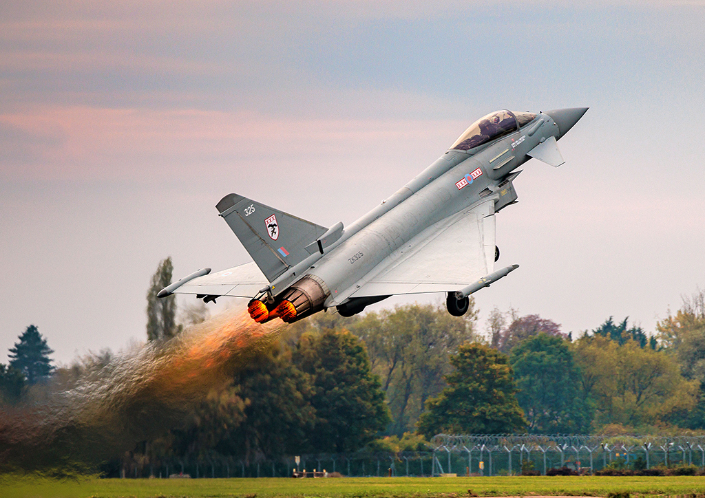 The Typhoon's afterburners are aflame as it launches into the air to carry out its display in spectacular fashion, showcasing rapid take-off, acceleration, and powerful 9G turns, a fitting symbol of the RAF’s cutting edge.